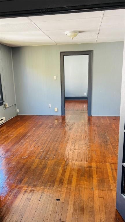 empty room featuring wood-type flooring