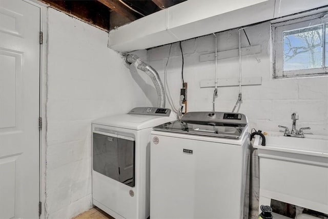 laundry area featuring sink and washer and dryer