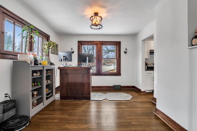 entrance foyer with dark wood-type flooring and plenty of natural light