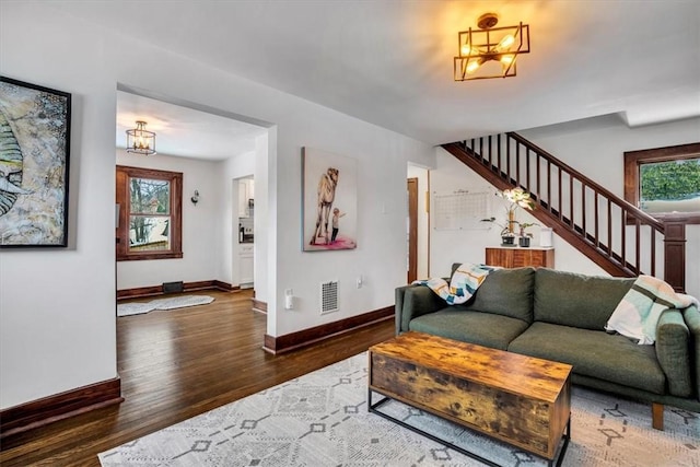 living room with dark hardwood / wood-style flooring