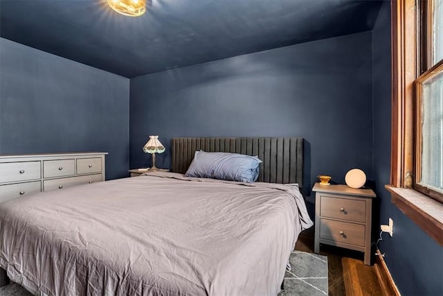 bedroom featuring dark hardwood / wood-style flooring