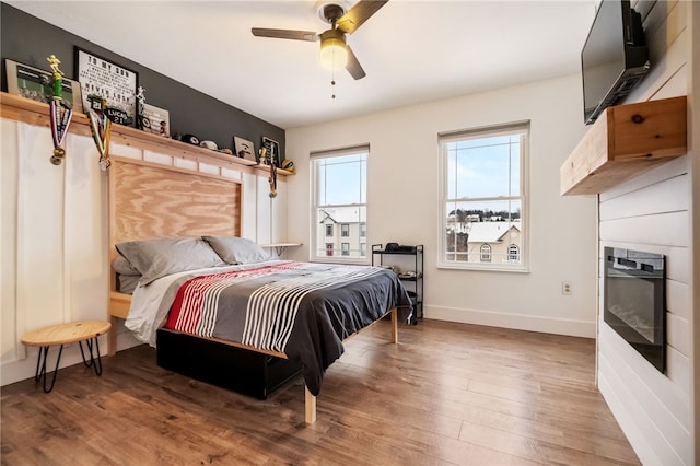 bedroom featuring ceiling fan and hardwood / wood-style floors