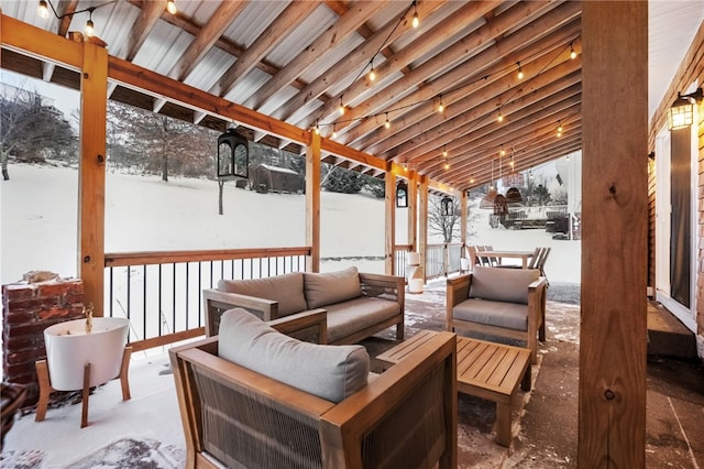 snow covered deck featuring an outdoor hangout area