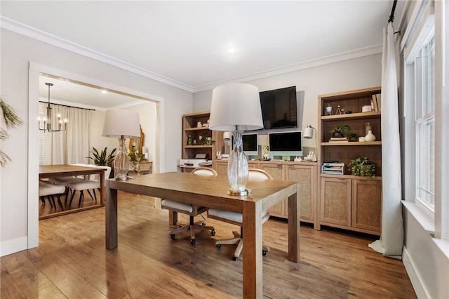 office area with crown molding, hardwood / wood-style flooring, and a notable chandelier