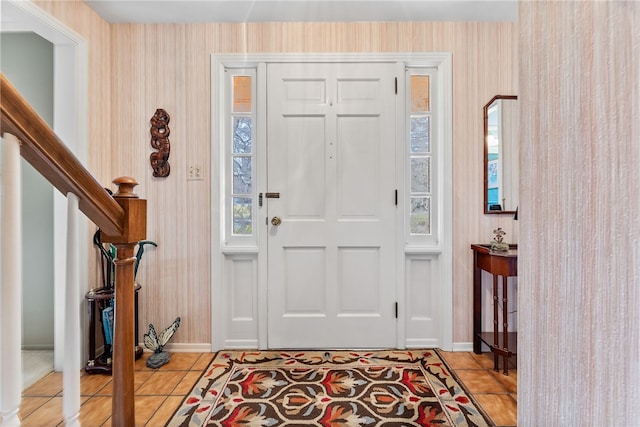 foyer entrance with light tile patterned floors