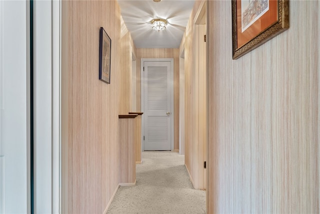 hallway featuring light colored carpet