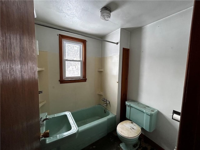 full bathroom with toilet, sink, shower / tub combination, and a textured ceiling