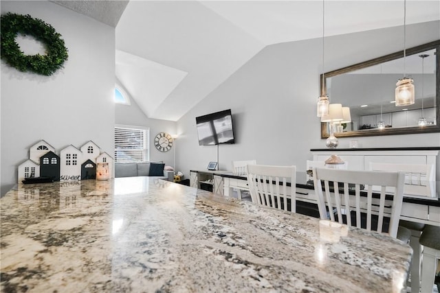 living room with vaulted ceiling