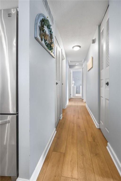 hall featuring light hardwood / wood-style floors