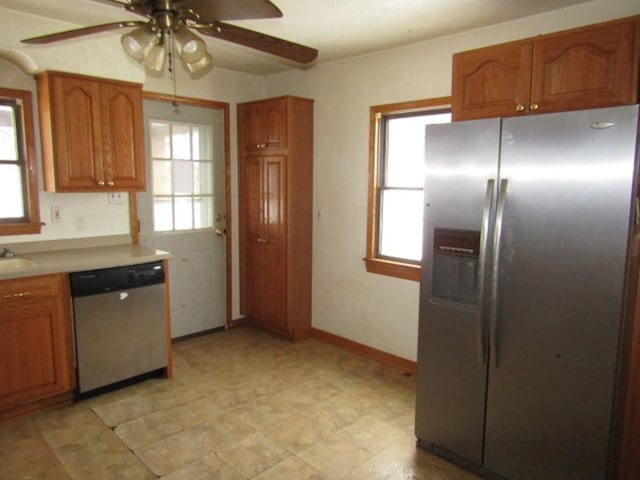 kitchen with ceiling fan, appliances with stainless steel finishes, and sink