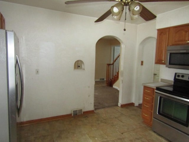 kitchen featuring ceiling fan and appliances with stainless steel finishes