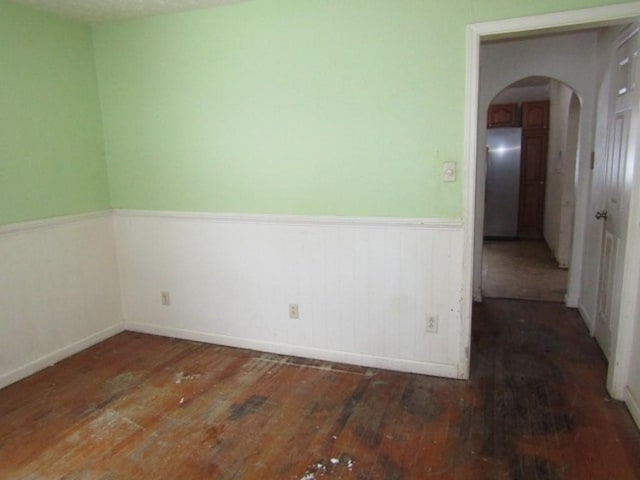 empty room featuring dark wood-type flooring