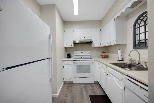 kitchen featuring white cabinetry, sink, white appliances, and light hardwood / wood-style flooring