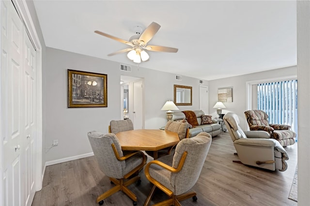 dining area featuring ceiling fan and light hardwood / wood-style floors