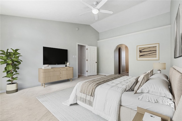 bedroom with vaulted ceiling, carpet floors, and ceiling fan