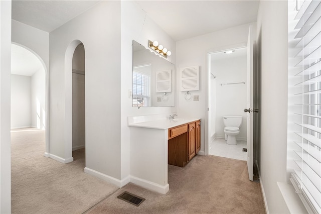 bathroom featuring vanity and toilet