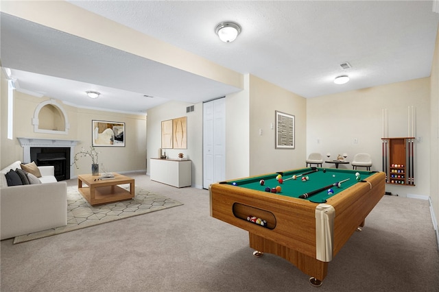 rec room featuring light colored carpet, pool table, and a textured ceiling