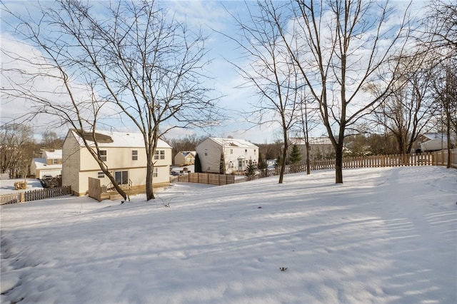 view of yard layered in snow