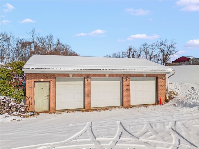 view of snow covered garage