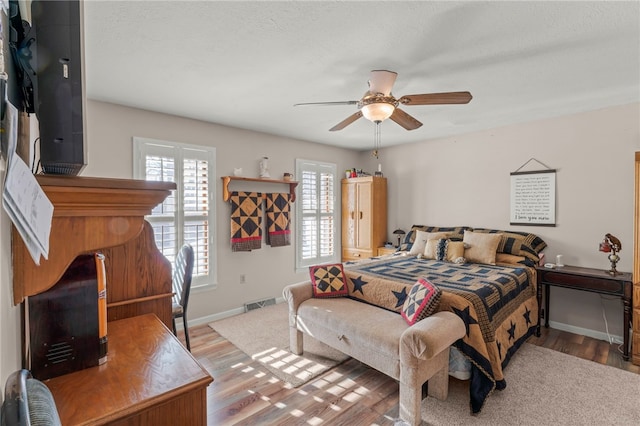 bedroom featuring ceiling fan and light wood-type flooring