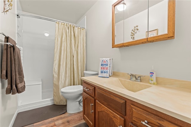 full bathroom featuring vanity, wood-type flooring, shower / bath combo, and toilet