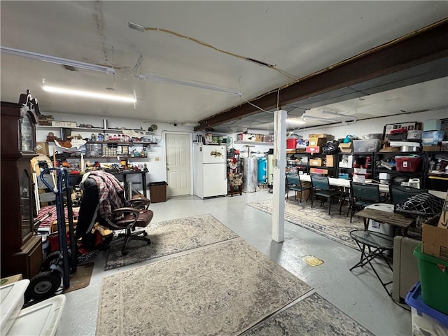 garage with white refrigerator and gas water heater