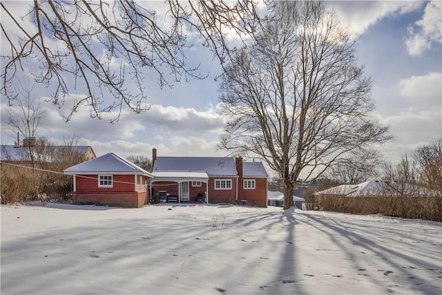 view of snow covered property