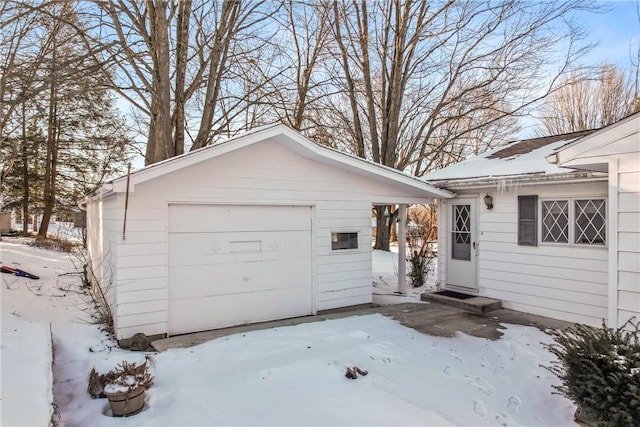 view of snow covered garage