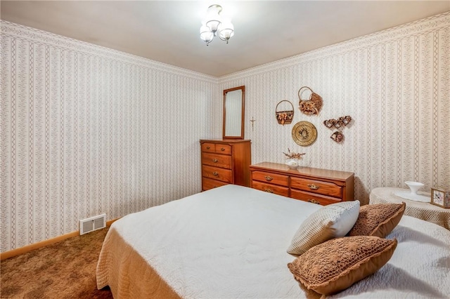 carpeted bedroom featuring crown molding