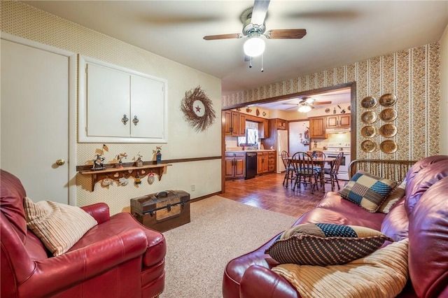 living room with ceiling fan and parquet flooring