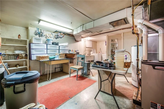 basement featuring separate washer and dryer and gas water heater