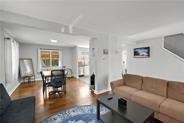 living room with dark hardwood / wood-style flooring