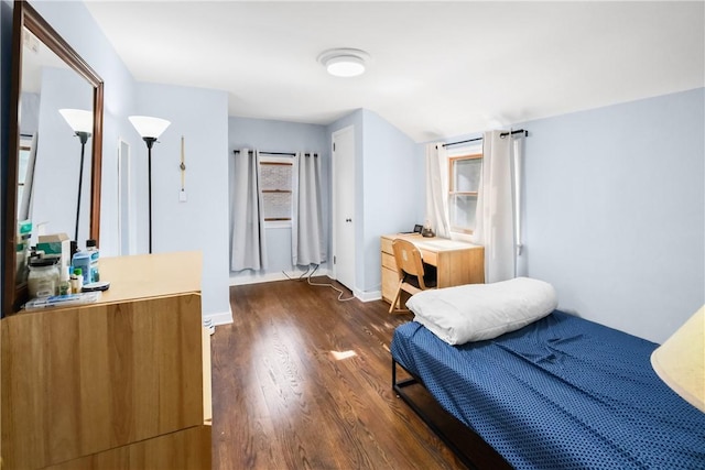 bedroom featuring dark wood-type flooring