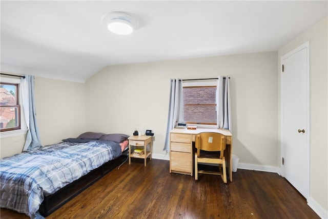 bedroom featuring vaulted ceiling and dark hardwood / wood-style floors