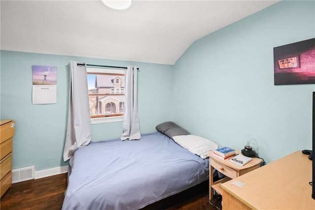 bedroom featuring vaulted ceiling and dark hardwood / wood-style floors