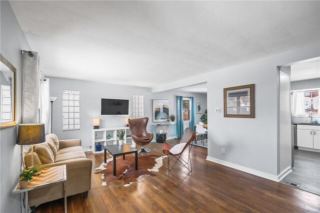 living room with dark wood-type flooring