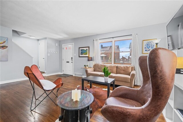 living room featuring dark wood-type flooring