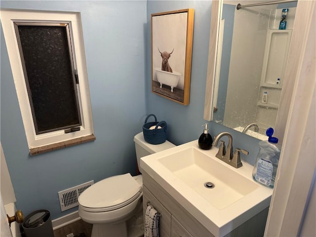 bathroom with toilet and vanity