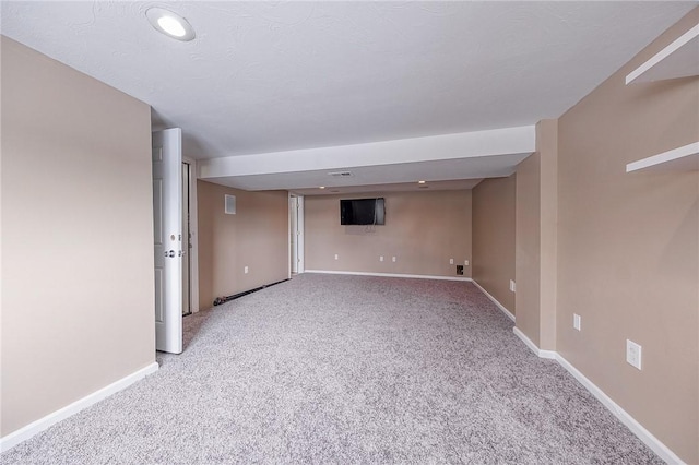 basement featuring carpet flooring