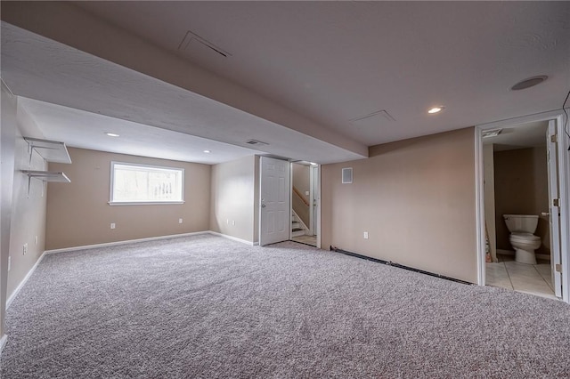 basement featuring light colored carpet