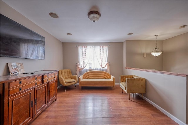 living area with light hardwood / wood-style floors