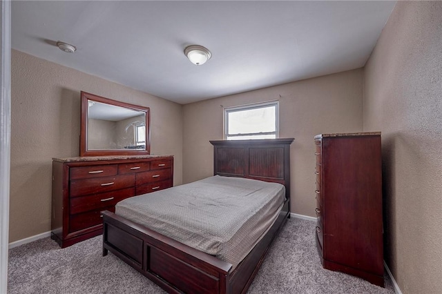 bedroom featuring light colored carpet