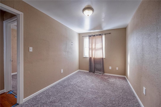 unfurnished room with carpet floors