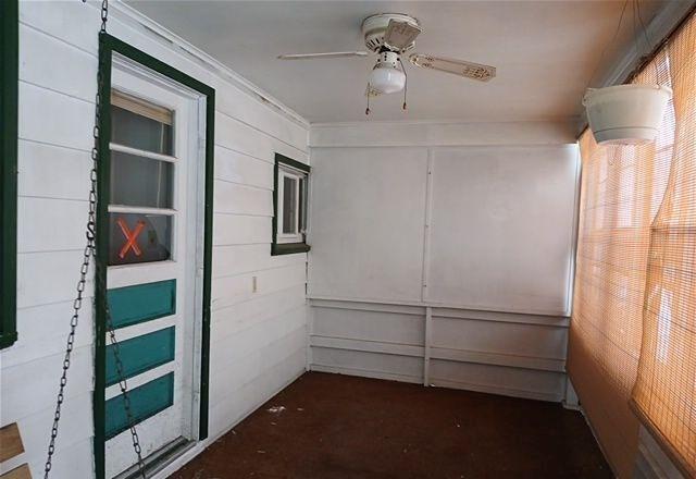 unfurnished room featuring ceiling fan