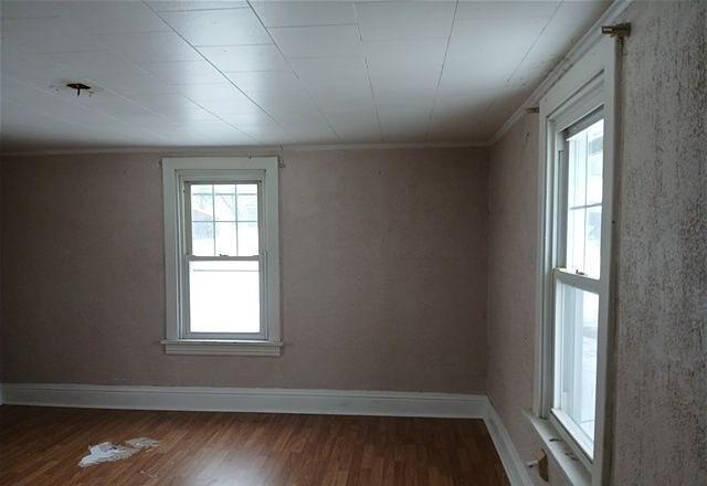 spare room featuring hardwood / wood-style floors