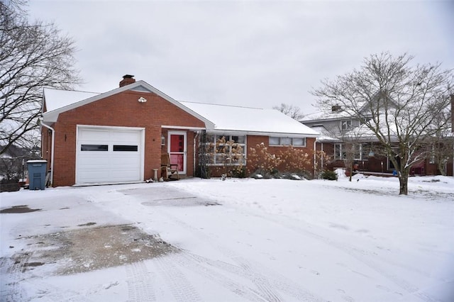 ranch-style home featuring a garage