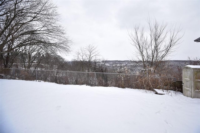 view of yard layered in snow