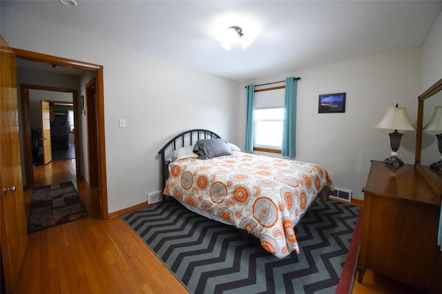 bedroom with wood-type flooring