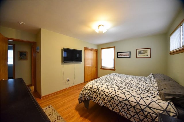 bedroom featuring a closet and light hardwood / wood-style flooring