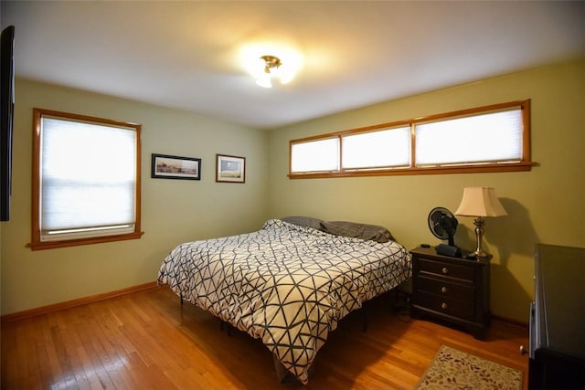 bedroom with light hardwood / wood-style floors